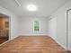 Bedroom featuring hardwood floors, window, and an ensuite bathroom at 116 Honeywood Ave, Charlotte, NC 28216
