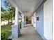 Charming front porch with brick columns and a view of the landscaped front yard at 116 Honeywood Ave, Charlotte, NC 28216