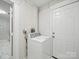 Laundry room featuring a white washing machine and an exterior door for convenience at 116 Honeywood Ave, Charlotte, NC 28216