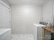 Basement laundry room with marble-patterned floors and white painted block walls at 116 Honeywood Ave, Charlotte, NC 28216