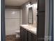 Bathroom with double vanity, shower, and tiled backsplash at 1856 Kemp Cir, Shelby, NC 28152