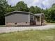 Home exterior with a front porch and wooden deck at 1856 Kemp Cir, Shelby, NC 28152