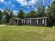 Charming single-story home features a covered porch and lush green lawn at 1856 Kemp Cir, Shelby, NC 28152