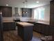Well-equipped kitchen with an island, stainless appliances, and butcher block countertops at 1856 Kemp Cir, Shelby, NC 28152