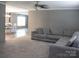 Spacious living room with plush carpeting and a comfortable sectional sofa at 1856 Kemp Cir, Shelby, NC 28152