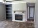 Cozy fireplace and built-in shelving create a warm atmosphere in the living area at 1856 Kemp Cir, Shelby, NC 28152