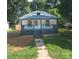 Charming single-story home with a cozy front porch and well-maintained lawn at 1919 Gay St, Statesville, NC 28625
