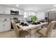 Contemporary kitchen with stainless steel appliances and an adjacent dining area at 1919 Gay St, Statesville, NC 28625