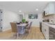 Modern eat-in kitchen with white cabinets, stainless steel appliances, and stylish dining set at 1919 Gay St, Statesville, NC 28625