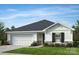 Charming one-story home featuring stone accents, black shutters, and a manicured front lawn at 2179 Norwood Ct, Denver, NC 28037