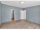 This bedroom features wood-look flooring and neutral walls at 2611 Dallas Stanley Hwy, Stanley, NC 28164