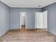The bedroom features wood-look flooring and neutral walls at 2611 Dallas Stanley Hwy, Stanley, NC 28164
