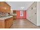 Bright kitchen features wood cabinets, mosaic backsplash, and wood floors at 2611 Dallas Stanley Hwy, Stanley, NC 28164