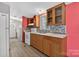 Kitchen with wooden cabinets, mosaic tile backsplash, and a white stove at 2611 Dallas Stanley Hwy, Stanley, NC 28164