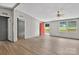 Bright living room features wood floors, large windows and neutral colored walls at 2611 Dallas Stanley Hwy, Stanley, NC 28164