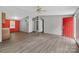 Spacious living room with wood floors, gray walls, and red front door at 2611 Dallas Stanley Hwy, Stanley, NC 28164