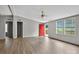Large living room with neutral paint, red front door, and vinyl floors at 2611 Dallas Stanley Hwy, Stanley, NC 28164