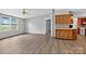 Open concept living room with wood floors and view to the kitchen cabinets at 2611 Dallas Stanley Hwy, Stanley, NC 28164