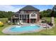 Expansive backyard with a large pool, multiple seating areas, and an outdoor kitchen, ideal for entertaining guests at 330 Waters Rd, Salisbury, NC 28146