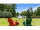 A relaxing backyard with two chairs facing a scenic lake, perfect for unwinding and enjoying nature at 330 Waters Rd, Salisbury, NC 28146