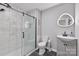 The bathroom features gray cabinets, and a tiled shower with black trim and glass doors at 330 Waters Rd, Salisbury, NC 28146