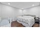 This bedroom has a dark hardwood floor and a queen bed with decorative comforter at 330 Waters Rd, Salisbury, NC 28146