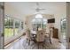 Bright dining area with lots of natural light, a round table, and views of the green outdoors at 330 Waters Rd, Salisbury, NC 28146