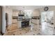 Well-equipped kitchen boasting an island, stainless steel appliances, custom cabinets and tile flooring at 330 Waters Rd, Salisbury, NC 28146
