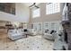 Inviting living room with soaring ceilings, large windows, fireplace, and open access to the kitchen at 330 Waters Rd, Salisbury, NC 28146