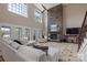Stunning living room with soaring ceilings, stone fireplace, and windows offering backyard views at 330 Waters Rd, Salisbury, NC 28146