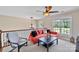 Upstairs living room with an orange sofa, a dark coffee table, and a cozy reading chair at 330 Waters Rd, Salisbury, NC 28146