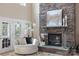 Cozy living room area with a stone fireplace, neutral colors and access to the backyard at 330 Waters Rd, Salisbury, NC 28146