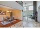 Open-concept living space with soaring ceilings, hardwood floors, and a stone fireplace, great for entertaining at 330 Waters Rd, Salisbury, NC 28146