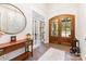 Foyer featuring hardwood floors and natural light from the french doors at 4033 Hilton Lake Rd, Kannapolis, NC 28083