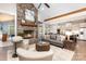 Spacious living room featuring a stone fireplace and open layout to the modern kitchen at 4033 Hilton Lake Rd, Kannapolis, NC 28083