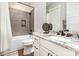 Bathroom with granite countertop, black hardware, tile flooring, and shower with tile surround at 4033 Hilton Lake Rd, Kannapolis, NC 28083
