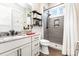 This bathroom features a modern vanity with granite counters and a stylish glass-enclosed shower at 4033 Hilton Lake Rd, Kannapolis, NC 28083