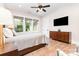 Comfortable bedroom with a ceiling fan, wood floors, and natural light at 4033 Hilton Lake Rd, Kannapolis, NC 28083