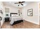 Bedroom with black furniture, wood look flooring, and large windows at 4033 Hilton Lake Rd, Kannapolis, NC 28083