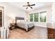 Bright bedroom features large windows, wood floors, and a ceiling fan at 4033 Hilton Lake Rd, Kannapolis, NC 28083