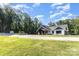Exterior of a single-Gathering home with a large yard and mature trees at 4033 Hilton Lake Rd, Kannapolis, NC 28083
