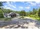 Beautiful home with modern white siding, gray shingles, and a charming wood and stone porch at 4033 Hilton Lake Rd, Kannapolis, NC 28083