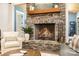 Cozy fireplace with stone surround and wood mantle at 4033 Hilton Lake Rd, Kannapolis, NC 28083
