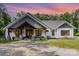 Charming exterior of a home with stone accents, wooden beams, and a covered porch at 4033 Hilton Lake Rd, Kannapolis, NC 28083