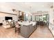 Open-concept kitchen with island seating, stainless steel appliances, and views of the living and dining areas at 4033 Hilton Lake Rd, Kannapolis, NC 28083