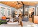 Relaxing living area with a wood ceiling, stone fireplace, and easy access to kitchen at 4033 Hilton Lake Rd, Kannapolis, NC 28083