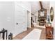 Open-concept living room with fireplace, stone surround, white walls, and natural light at 4033 Hilton Lake Rd, Kannapolis, NC 28083