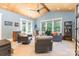 Cozy sunroom featuring ample natural light, vaulted ceilings, and comfortable seating at 4033 Hilton Lake Rd, Kannapolis, NC 28083