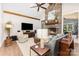 Inviting living room with stone fireplace, wood beams, and stylish decor at 4033 Hilton Lake Rd, Kannapolis, NC 28083