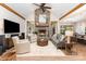 Inviting living room featuring a stone fireplace, vaulted ceilings, and hardwood floors at 4033 Hilton Lake Rd, Kannapolis, NC 28083